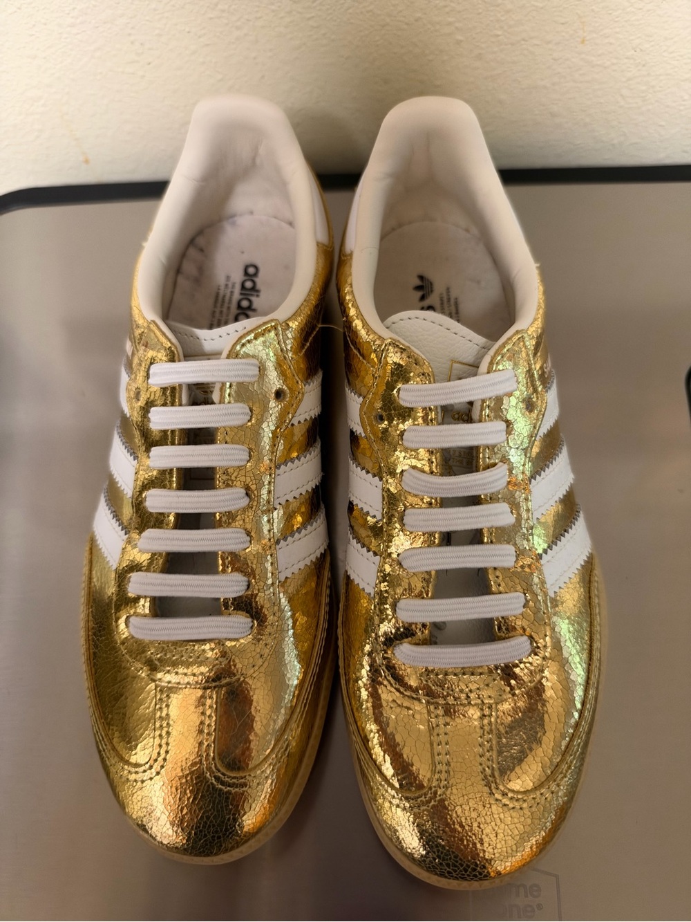 adidas Women’s Gold Metallic Classic Sneakers with White Stripes